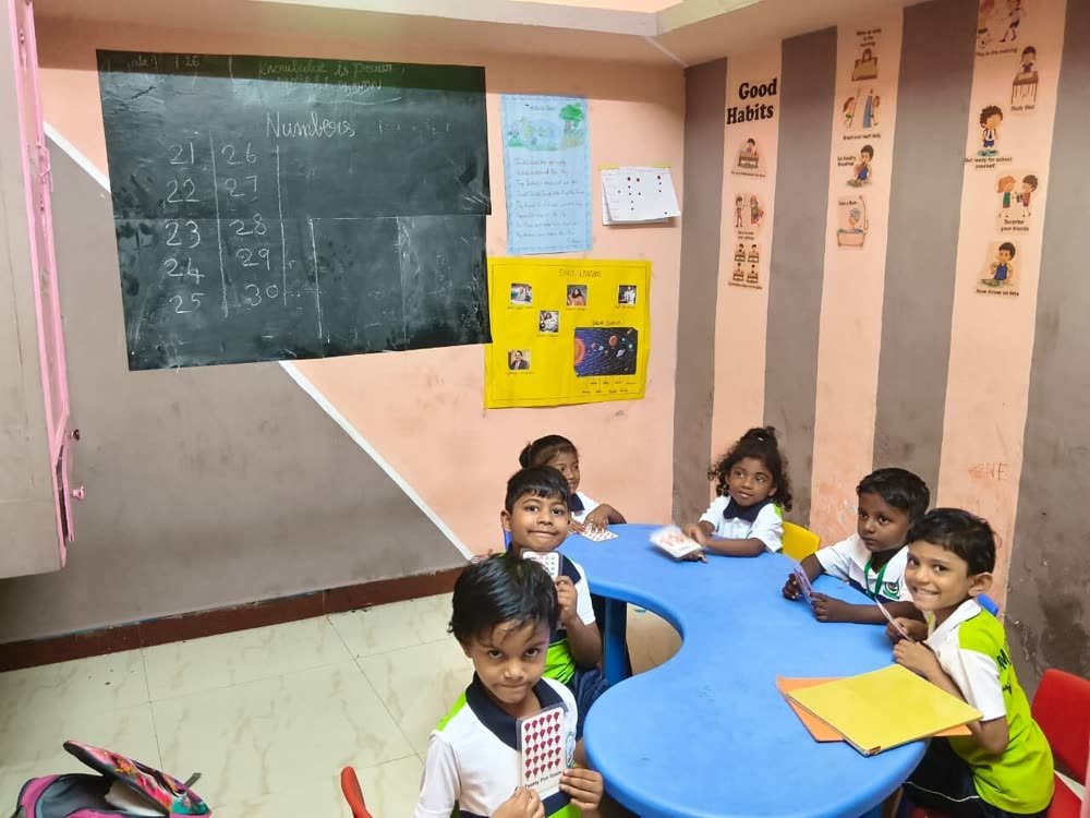 Children learning together with number cards
